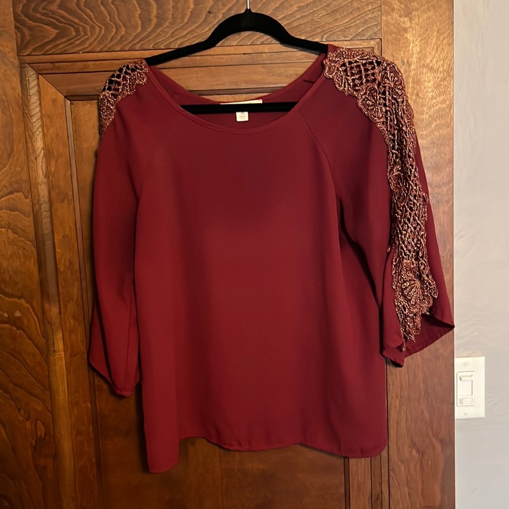 Beautiful maroon colored blouse with glittery lace arm details